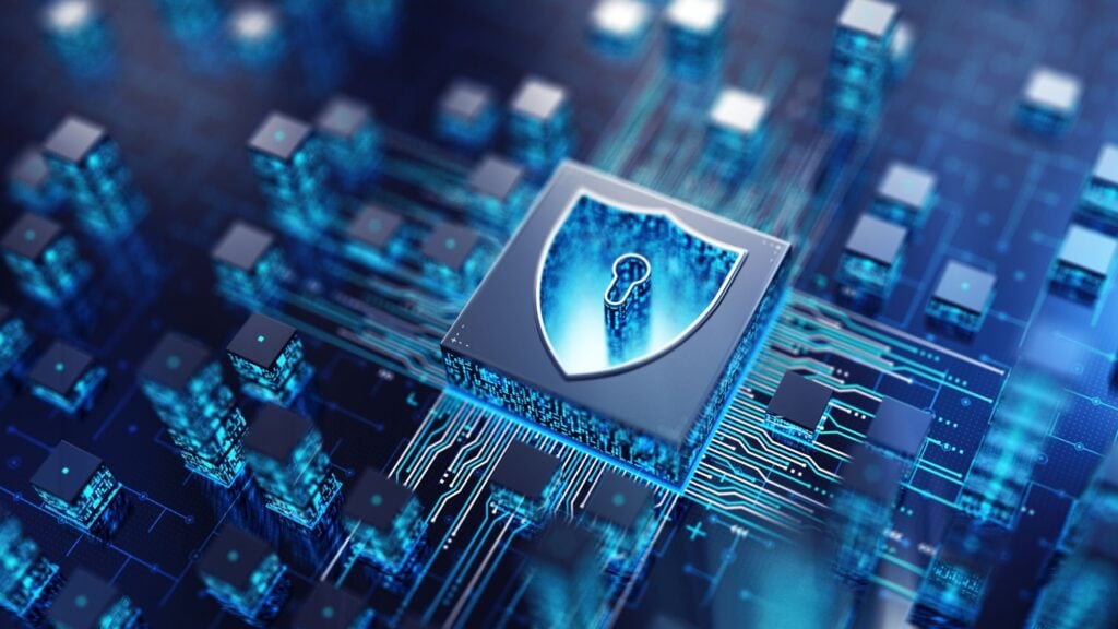 A digital rendering of a computer chip with a shield and keyhole symbol, highlighting the importance of cyber security on a circuit board background for the construction industry.