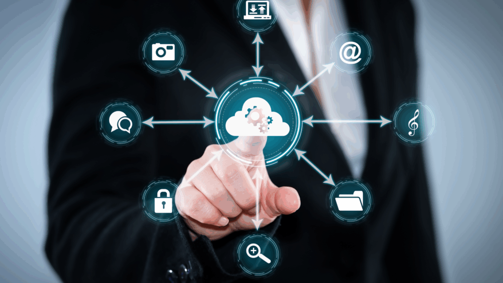 A person in a suit touches a virtual screen displaying a cloud icon linked to various digital service icons, representing how managed service providers (MSPs) enable seamless cloud computing and data integration.